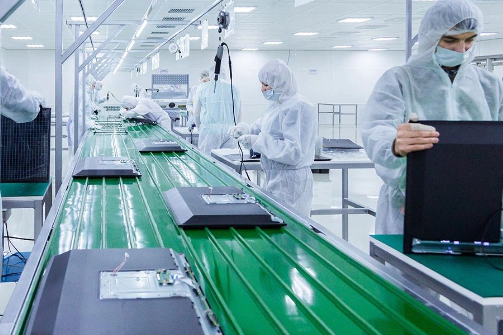 Engineer reviewing a build at a contract manufacturing partner facility